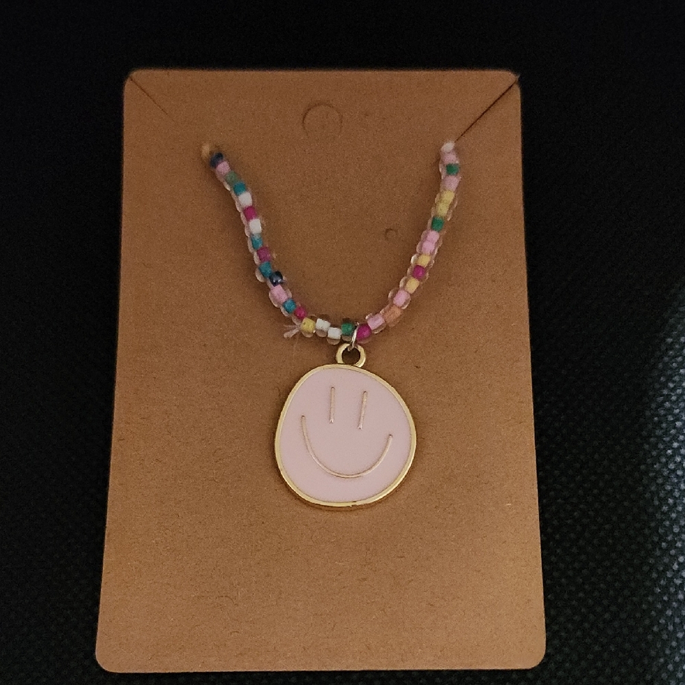 Colorful Beaded Bracelet with Pink Smiley Pendant